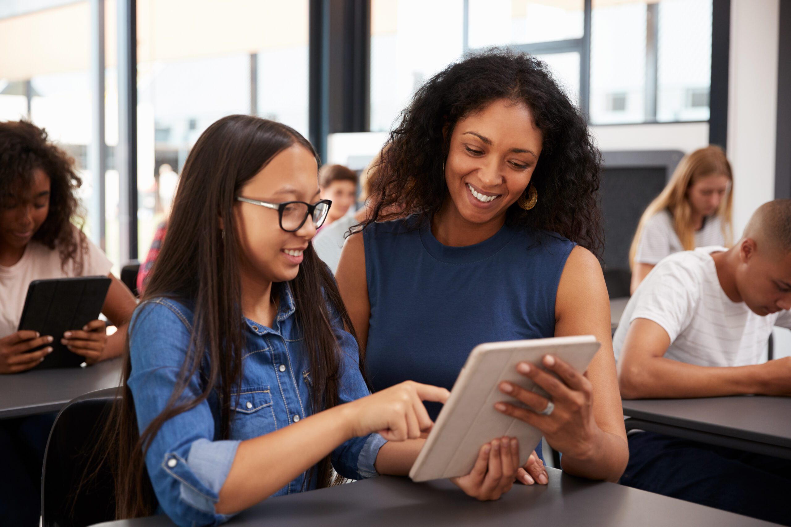 Teacher Helping Teenage Schoolgirl